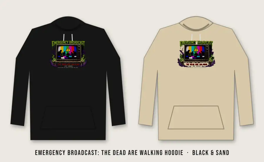 Emergency Broadcast: The Dead Are Walking Hoodie: TV color bars reading NO SIGNAL above a black emergency panel: yellow warning triangle with a rising zombie hand, VT323 terminal text EMERGENCY ALERT SYSTEM / THE DEAD AR