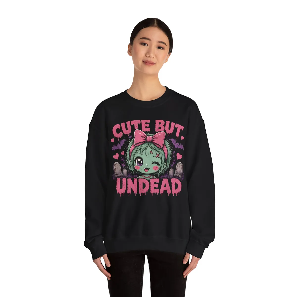 Cute But Undead Pink Zombie Sweatshirt in Black: worn by a model