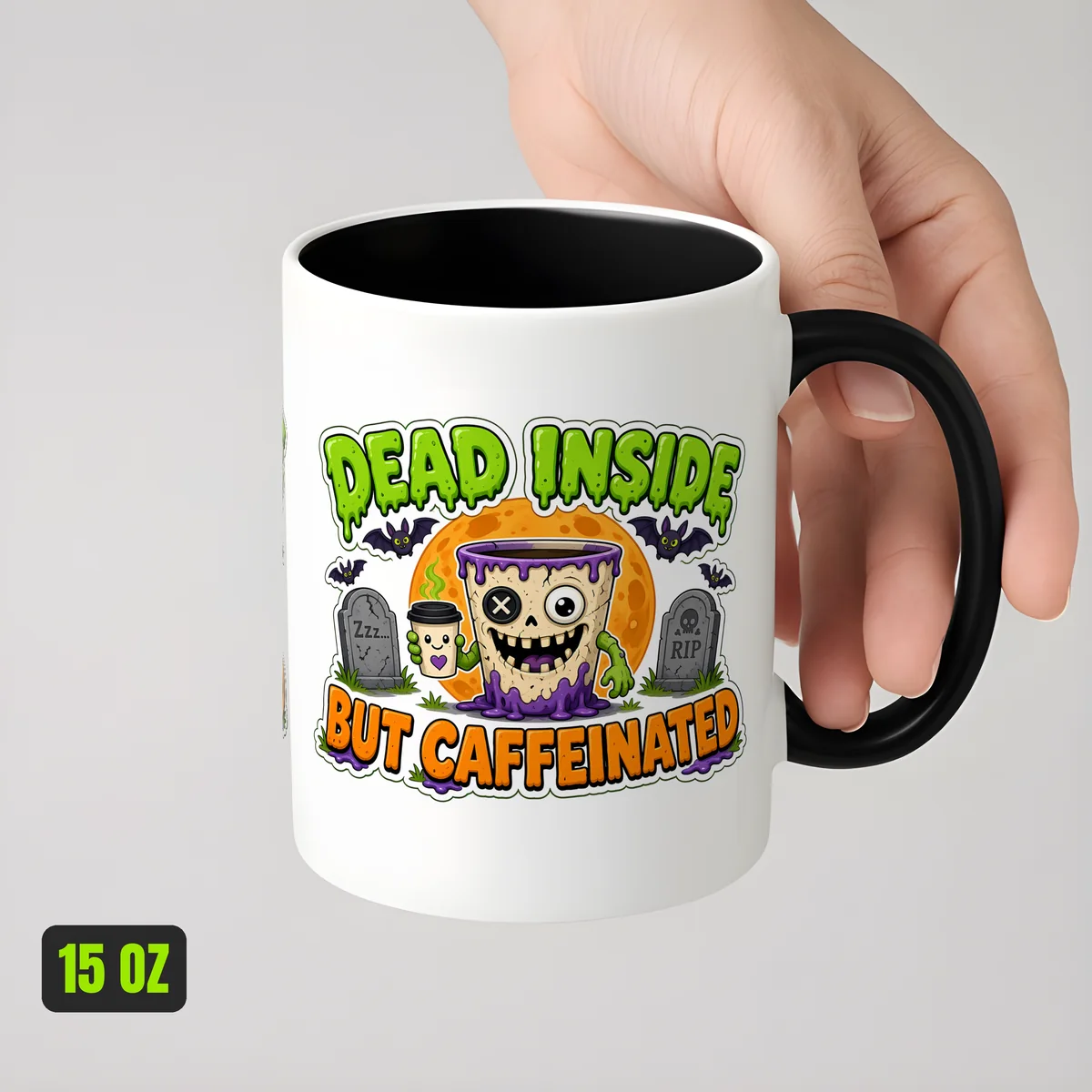 Dead Inside But Caffeinated Mug held in a hand to show the 15 oz size