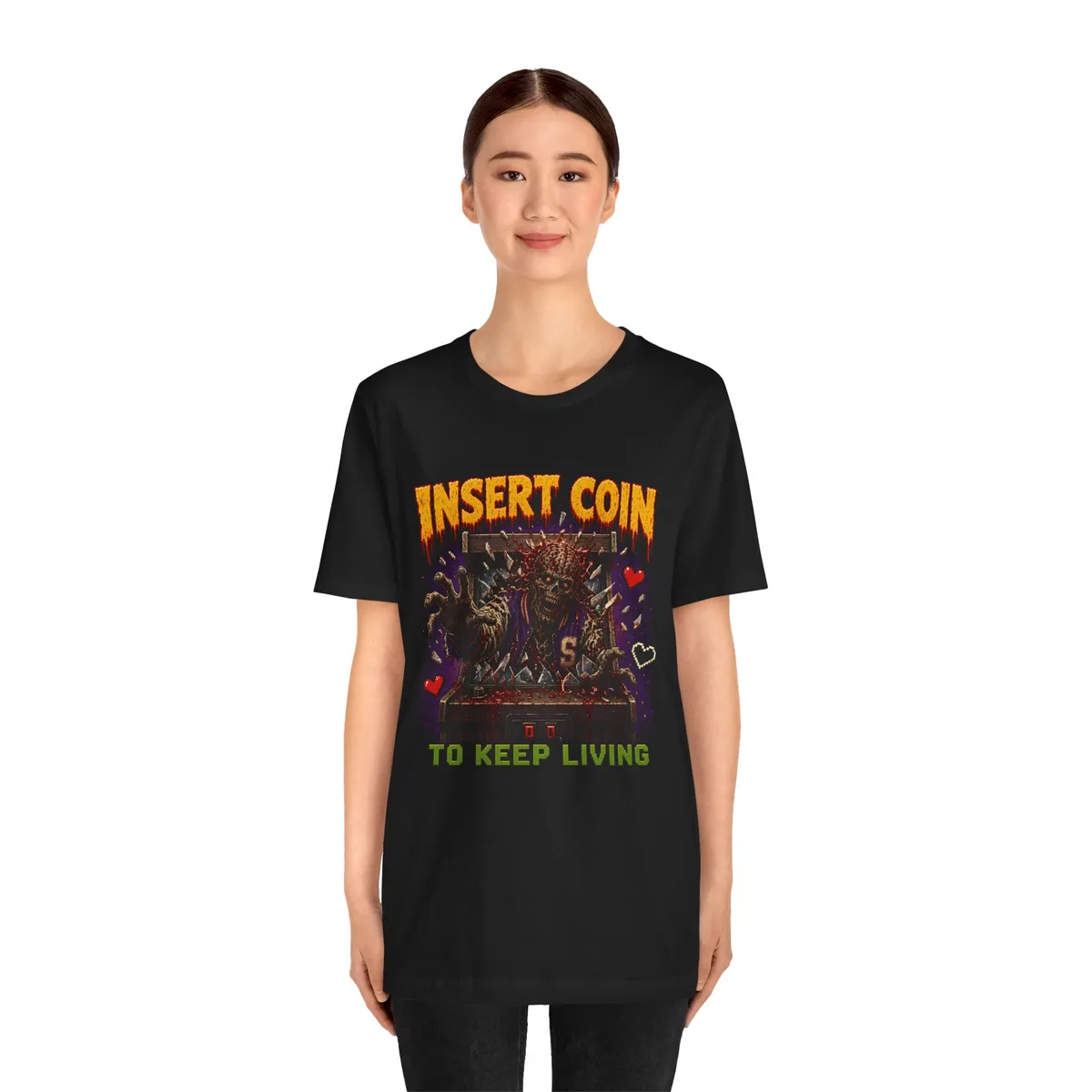 Insert Coin to Keep Living Pixel Zombie Tee in Black: worn by a model