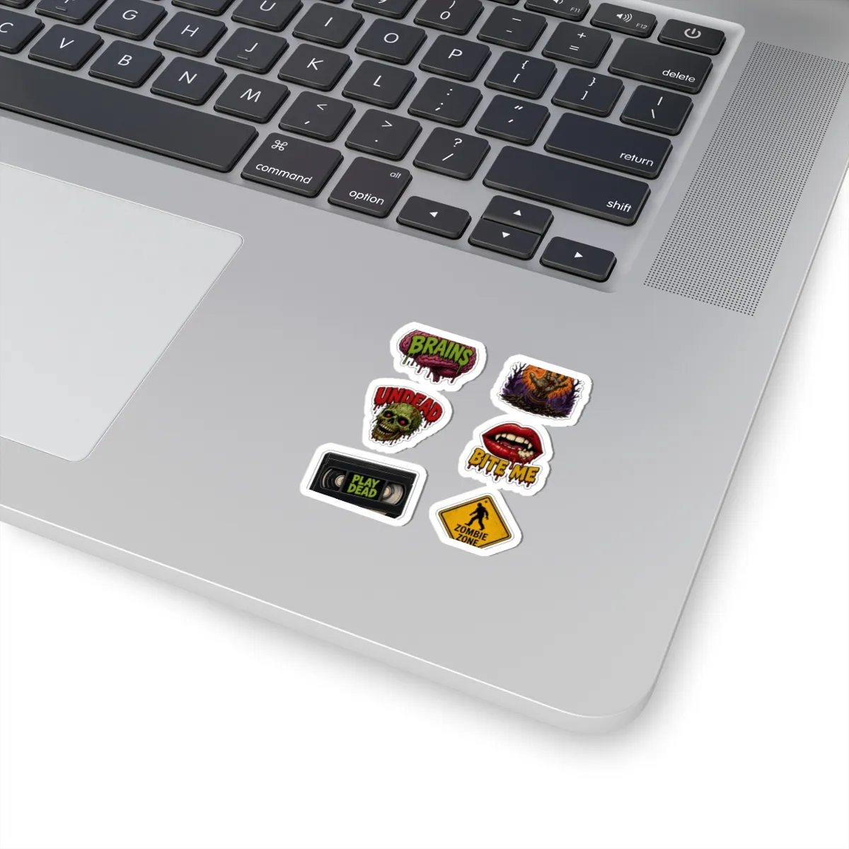 Zombie Survival Kit Sticker Sheet: on a laptop